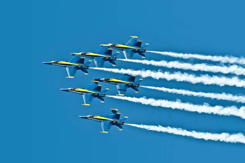 Diamond Pilots perform the Low Break Cross maneuver during a practice demonstration.