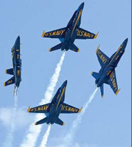 Four Blue Angels planes breaking formation