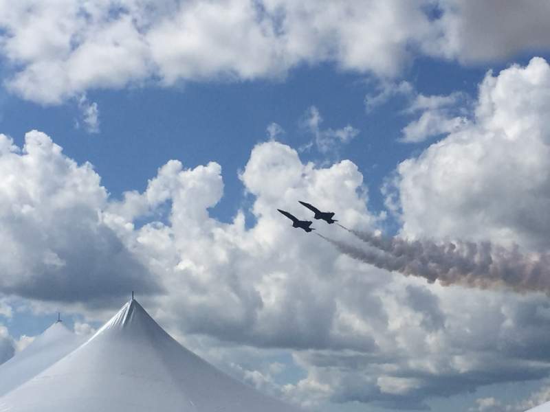 Two-jets-side-by-side-above-an-event-tent
